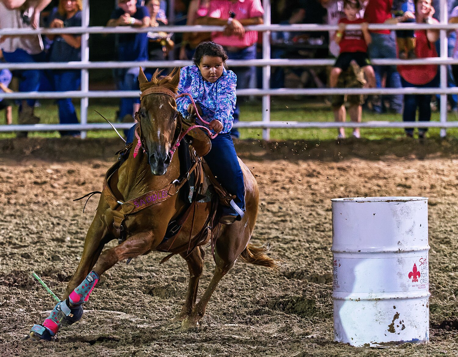 Undeterred by a slow start, the barrel-racer closes strong around the final turn. [see more sights and MFDR 2023 rodeo action]
